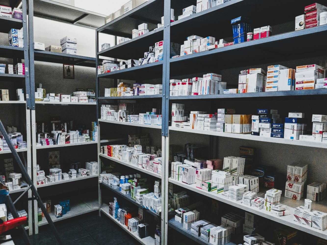 Pharmaceutical stock organised by shelf code in a distribution store